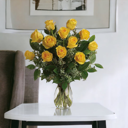 12 Stems Yellow Roses with Greens in a Clear Vase