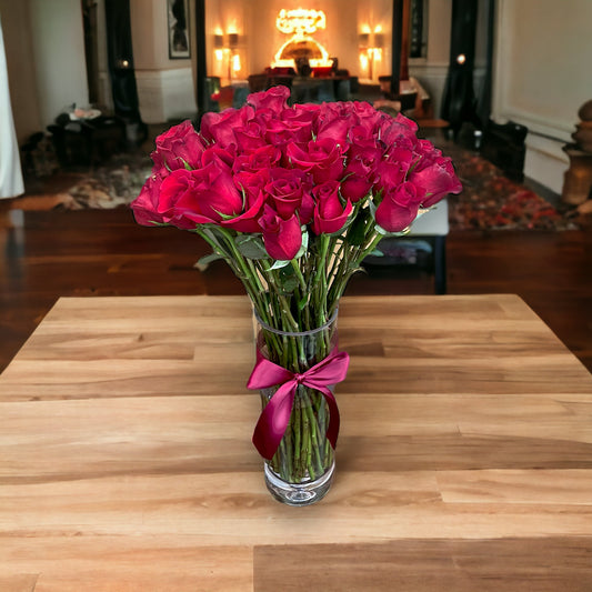 50 Stem Red Roses with a Clear Illusion Vase